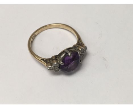 A 9 ct gold Ring inset with amethyst stone flanked by diamonds. Size M  - NO RESERVE