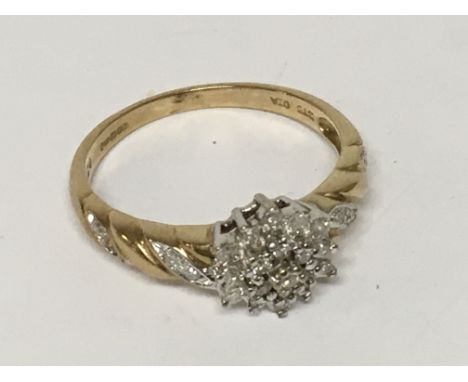 An all diamond 3 tier cluster ring with diamond set shoulder. Ring size R