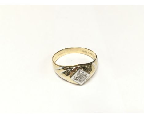 A fancy diamond set ring in gold.