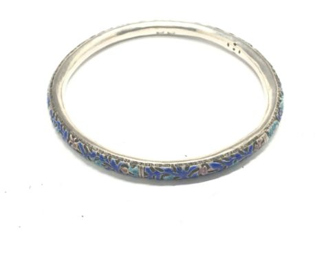 A Quality Antique Chinese silver bangle decorated with coloured enamels.