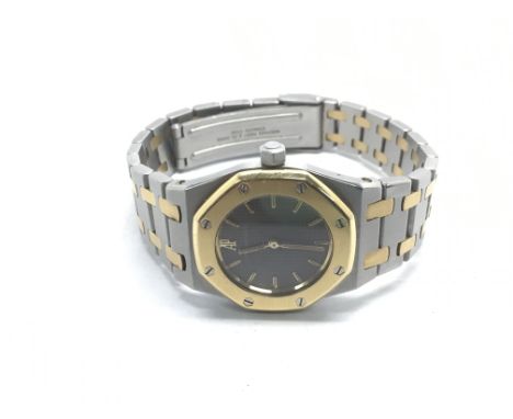 An Audemars Piguet stainless steel and gold quartz watch with baton numerals.