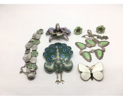 A collection of silver enamel jewellery including a brooch in the form of a peacock, bracelets etc.