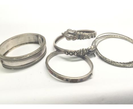 An antique silver bangle set with polished stones and other silver bracelets (a lot)