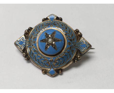 A Victorian enamel mourning brooch inset with seed pearl fitted in original box.