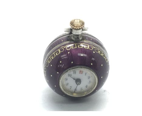 A 1920s silver and purple enamel ball shaped fob watch, approx width 2cm.