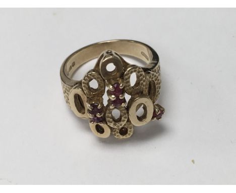 A 9 ct gold ring of modern design inset with five small rubies size q total weight 7 grams.