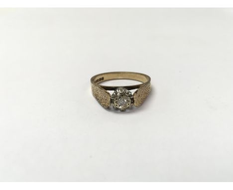 A 9ct gold ring set with a small diamond. The approximate ring size is between O and P  - NO RESERVE