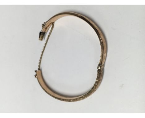 A gold bangle 7 .4 grams