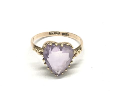 A vintage 9carat gold ring set with a heart shaped amethyst. Ring size O weight 2g