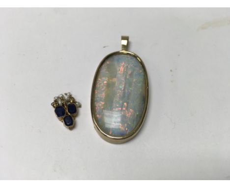 An oval pendant inset with coloured Opal stone and an miniature sapphire a pearl pendant.