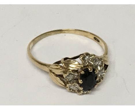 A sapphire and diamond ring. Size Q