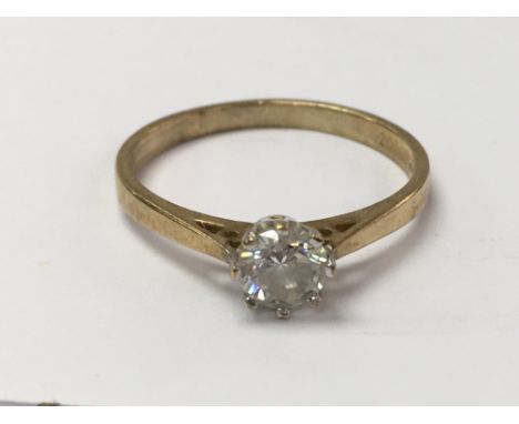 A 9ct gold ring set with a cubic zirconia stone. The approximate ring size is P - NO RESERVE