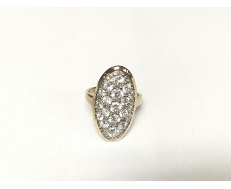 An Oval pave set ring in yellow and white gold.