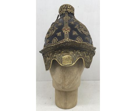 A scarce 19th century Korean Joseon dynasty helmet. Lacquered leather skull, with applied gilt copper dragons, and floriated 