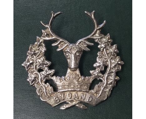 A vintage sterling silver officers cap badge for the Gordon Highlanders. A die stamped example, which standard design and ‘By