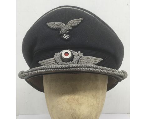 A fine quality, WW2 era private purchase Luftwaffe Officer’s visor cap, by Erel of Berlin. Manufactured by Robert Lubstein, a