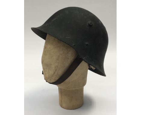 An unusual WW2 era Bulgarian M36 c type combat helmet, which appears to have been re-painted and re-badged for German personn