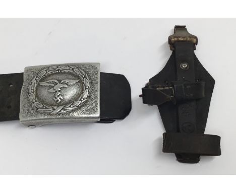 A WW2 era Luftwaffe aluminium belt buckle, with leather tab and belt. The buckle is seemingly unmarked, but the leather tab i