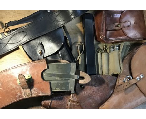 A selection of pistol holsters, magazine pouches, magazines and tools. Including 2 Swedish examples, a Swedish magazine holde