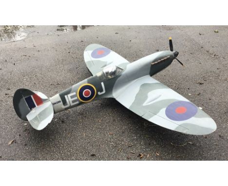 A large scale model of a WW2 Spitfire fighter plane. Likely constructed in the latter part of the 20th century, and appears t