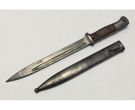 A pre WW2 1936 dated German K98 bayonet, made by Carl Eickhorn of Solingen. Complete with associated, but non matched scabbar
