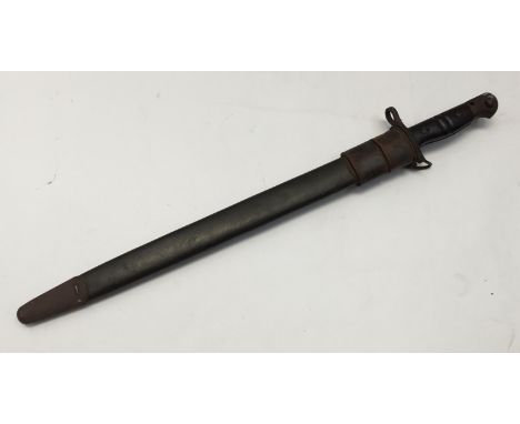 A WW1 era, United States M1917 bayonet, complete with scabbard. Standard double groove cut walnut grips, with steel pommel an
