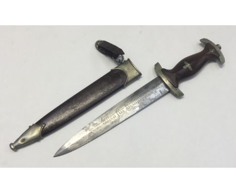 A WW2 era S.A dagger, complete with scabbard and leather belt loop. Etched motto to blade, which reads ‘Alles fur Deutschland