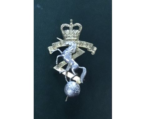 A vintage Royal Electrical and Mechanical Engineers (REME) sterling silver cap badge. Made to mimic the traditional cap badge