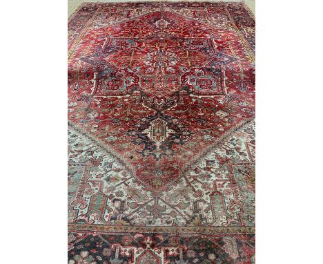 HERIZ CARPET, red lozenge serrated field and ivory/teal spandrels, broad dark border, 412 x 289cmsProvenance: private collect