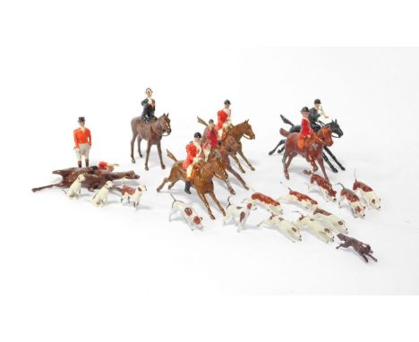 A Britain's hunting set, comprising seven hunters on horseback, a standing hunter, fox and thirteen hounds. 