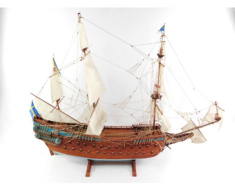 A 20thC wooden scale model of The Swedish 17thC Warship Vasa, scale 1:75, on a wooden stand, 107cm L.