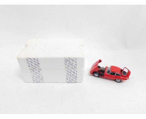 A Franklin Mint die cast model of a red Jaguar E type, scale 1:24, boxed.