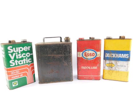 Three vintage oil cans, comprising BP, Esso, Duckhams, together with a Shell petrol can. (4)