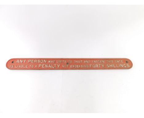 A vintage cast iron railway sign, inscribed Any Person Who Omits To Shut And Fasten This Gate Is Liable To a Penalty Not Exce