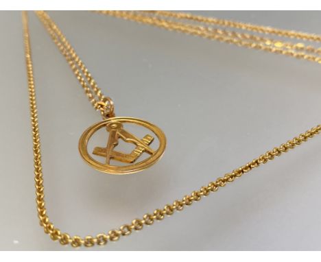 A 9ct gold Masonic pendant, modelled as a compass and set square, on an unmarked tracelink chain; together with a tracelink n