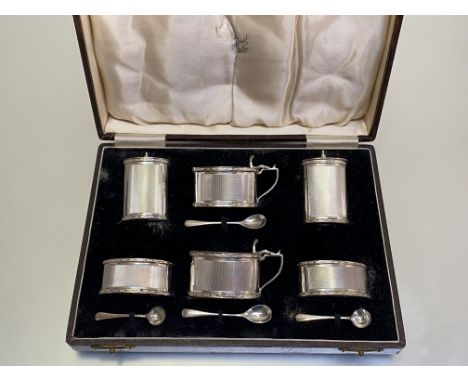 A cased silver six piece condiment set, J.B. Chatterley &amp; Sons Ltd, Birmingham 1936, each piece oval with an engine-turne