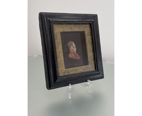 An English coloured wax relief portrait of an officer, c. 1810, in red uniform with gilt epaulettes, within a gilt slip and e