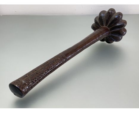 Fiji: a throwing club, (Ula), the cylindrical shaft with geometric chip-carved handle, the lobed head with domed finial. 42cm