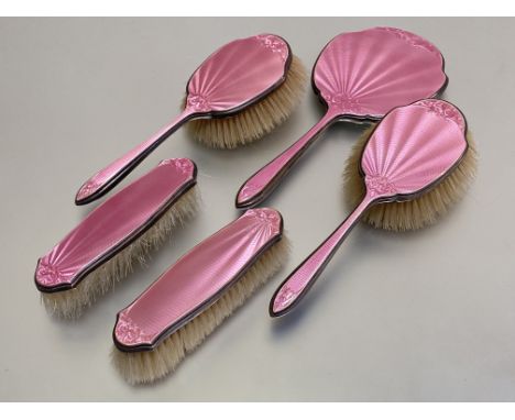 A George V silver and pink guilloche enamel dressing table set, Walker &amp; Hall, Sheffield, 1932, 1933 and 1936, the enamel