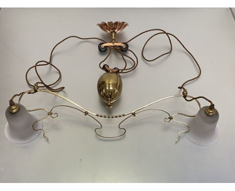 An Art Nouveau style brass rise and fall twin-light ceiling light, in the manner of W.A.S. Benson, the whiplash-scroll frame 