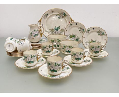 A rare Belleek First Period ring-handled ivory ware tea service in the Convolvulus pattern, comprising nine cups and ten sauc