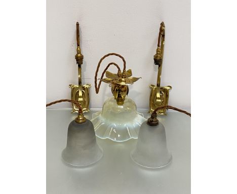 An Art Nouveau style brass and vaseline glass hanging light, in the manner of W.A.S. Benson, the scalloped shade beneath a br