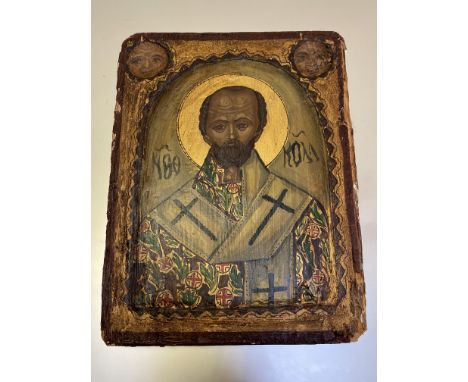 Russian School, an icon depicting a Saint, his robe decorated with crosses, against a gold ground, oil on panel. 24.5cm by 19