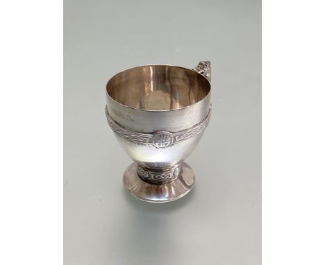A George VI Scottish silver cup, Brook &amp; Son, Edinburgh 1937, the bowl and stem decorated with Celtic bands and with serp