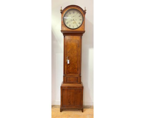 A Scottish Regency mahogany longcase clock, the arched hood with gilt brass finials above an arched trunk door flanked by qua