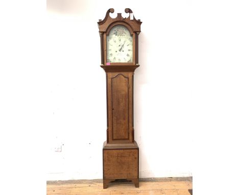 A George III oak longcase clock, early 19th century, the hood with swan neck pediment over fluted pilasters, above a mahogany