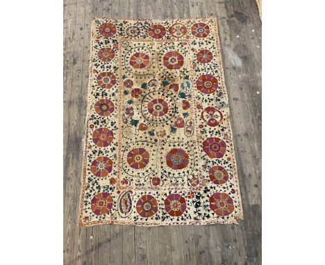 A Susani silk-embroidered linen panel, 19th century, worked in polychrome threads with flowerheads and scrolling foliage (sta