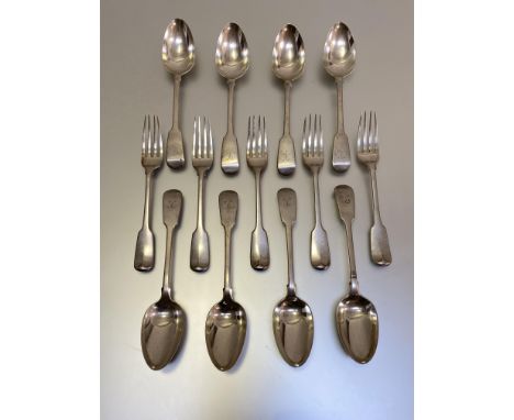 A set of eight George III Fiddle pattern table spoons, Paul Storr,  London 1816, each engraved with a crest; together with a 