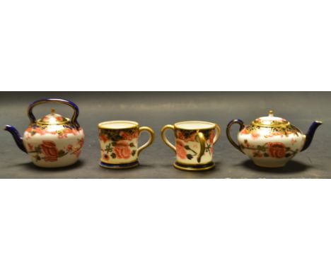 A Royal Crown Derby mini tea caddy; a Royal Crown Derby mini pin box; a Royal Crown Derby pin dish 