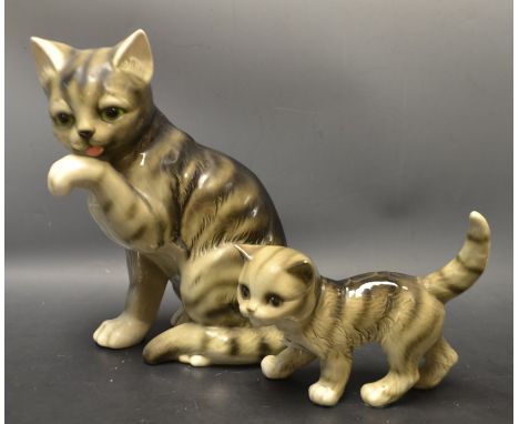 A large Goebel cat licking his paws, another Goebel figure of a cat (2)